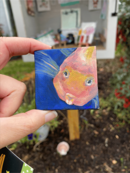 Close up of miniature art depicting a fish